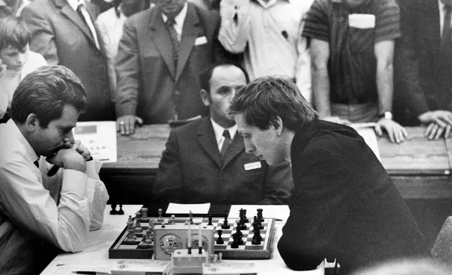 FILE - Reigning chess world champion Boris Spassky, left, of Russia, and international grandmaster Bobby Fischer of the United States, are seen during a game at the XIX World Chess Olympiad in Siegen, Germany, Sept. 20, 1970. (AP Photo/Heinz Ducklau, File)