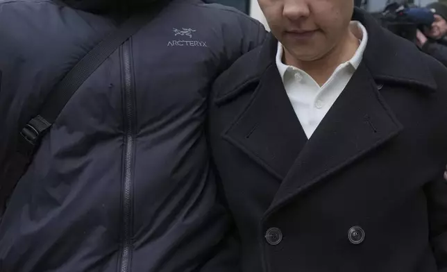 Chelsea and Australia soccer player Samantha Kerr, right, departs Kingston Crown Court, in south west London, Tuesday, Feb. 11, 2025, where she is was found not guilty on charges of alleged racially aggravated harassment of a police officer. (AP Photo/Kin Cheung)