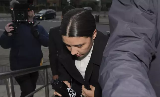 Chelsea and Australia soccer player Samantha Kerr arrives at Kingston Crown Court, in south west London, Tuesday, Feb. 11, 2025, where she is charged with alleged racially aggravated harassment of a police officer. (AP Photo/Kin Cheung)