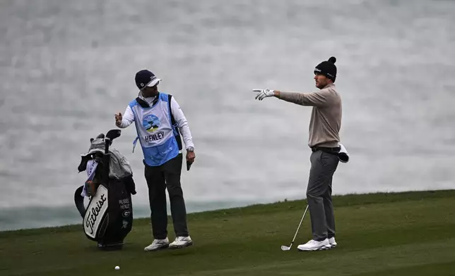 Russell Henley points as he looks down the 10th fairway at Pebble Beach Golf Links during the second round of the AT&amp;T Pebble Beach Pro-Am golf tournament, Friday, Jan. 31, 2025, in Pebble Beach, Calif. (AP Photo/Nic Coury)