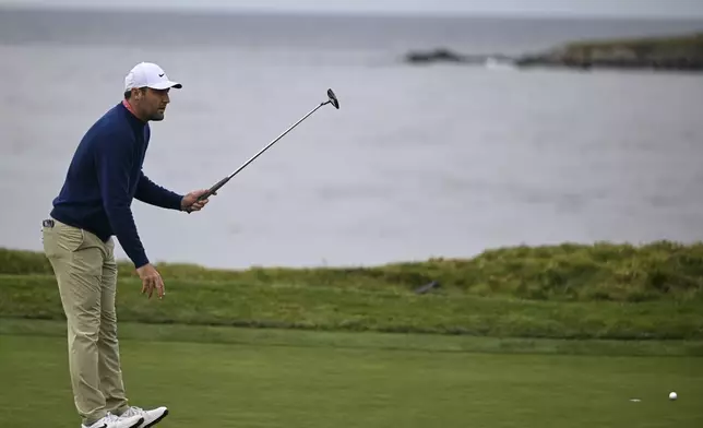 Scottie Scheffler reacts after missing a putt on the fourth hole at Pebble Beach Golf Links during the second round of the AT&amp;T Pebble Beach Pro-Am golf tournament, Friday, Jan. 31, 2025, in Pebble Beach, Calif. (AP Photo/Nic Coury)