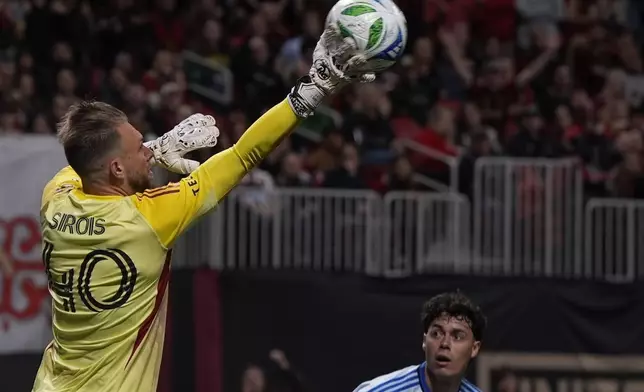 CF Montreal goalkeeper Jonathan Sirois (40) deflects an Atlanta United shot on goal during the first half of an MLS soccer game, Saturday, Feb. 22, 2025, in Atlanta. (AP Photo/Mike Stewart)