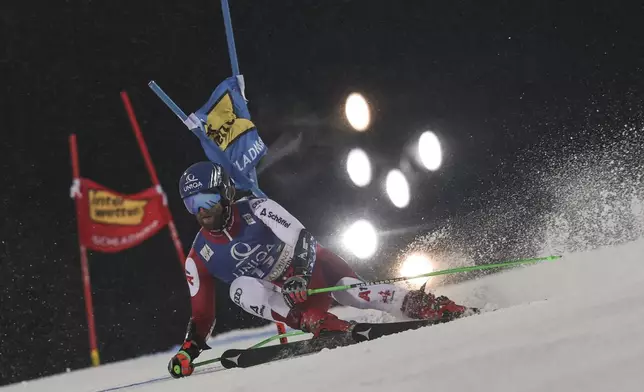 Austria's Marco Schwarz speeds down the course during a men's World Cup giant slalom, in Schladming, Austria, Tuesday, Jan. 28, 2025. (AP Photo/Marco Trovati)