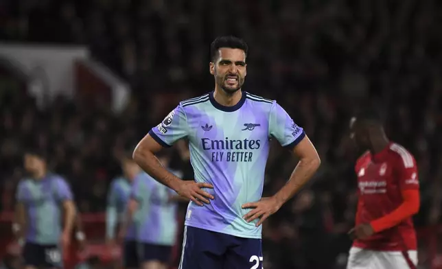Arsenal's Mikel Merino reacts during the English Premier League soccer match between Nottingham Forest and Arsenal at the City Ground stadium in Nottingham, England, Wednesday, Feb. 26, 2025. (AP Photo/Rui Viera)