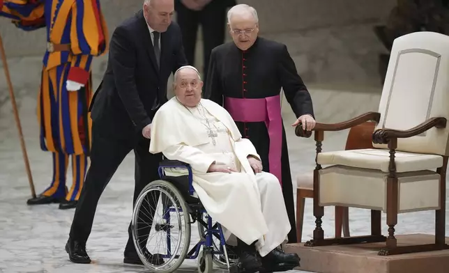 Pope Francis leaves at the end of a Jubilee audience in the Pope Paul VI hall at the Vatican, Saturday, Feb. 1, 2025. (AP Photo/Andrew Medichini)