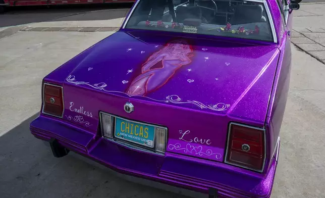 Joan Medina of Chimayo displays her 1987 lowrider Pontiac Grand Prix outside of the State Capitol in Santa Fe, New Mexico on Lowrider Day, Tuesday, Feb. 11, 2025 in Santa Fe, N.M. (AP Photo/Roberto E. Rosales)