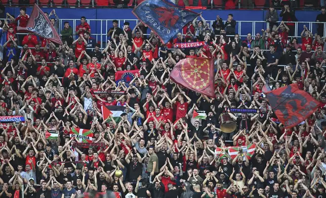 Osasuna fans celebrate after a Spanish La Liga soccer match between Osasuna and Real Madrid at El Sardar stadium in Pamplona, Spain, Saturday, Feb. 15, 2025. (AP Photo/Miguel Oses)