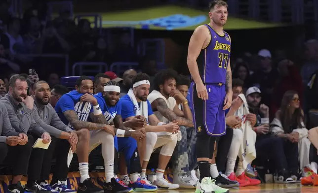 Los Angeles Lakers guard Luka Doncic (77) stands on the court during the second half of an NBA basketball game against the Dallas Mavericks, Tuesday, Feb. 25, 2025, in Los Angeles. (AP Photo/Mark J. Terrill)