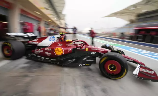 Ferrari driver Lewis Hamilton of Britain leaves the pit lane during a Formula One pre-season test at the Bahrain International Circuit in Sakhir, Bahrain, Thursday, Feb. 27, 2025. (AP Photo/Darko Bandic)