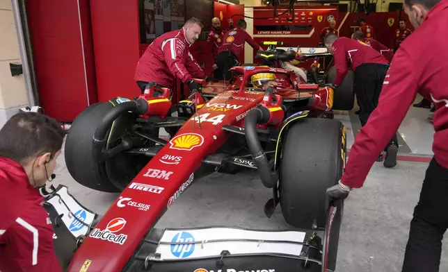 Crew pushes Ferrari driver Lewis Hamilton of Britain during a Formula One pre-season test at the Bahrain International Circuit in Sakhir, Bahrain, Thursday, Feb. 27, 2025. (AP Photo/Darko Bandic)
