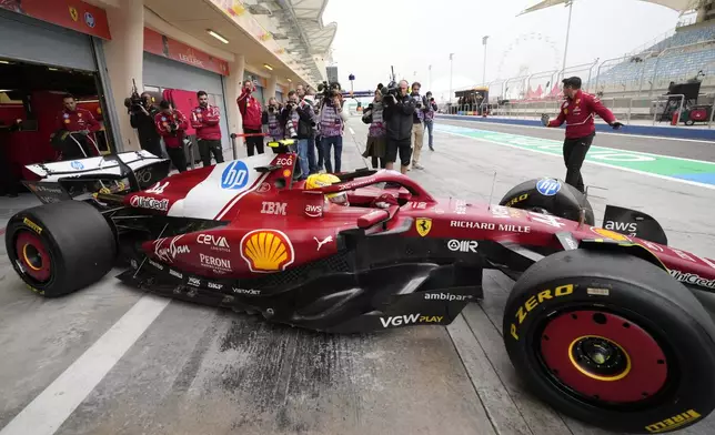 Ferrari driver Lewis Hamilton of Britain leaves the pit lane during a Formula One pre-season test at the Bahrain International Circuit in Sakhir, Bahrain, Thursday, Feb. 27, 2025. (AP Photo/Darko Bandic)