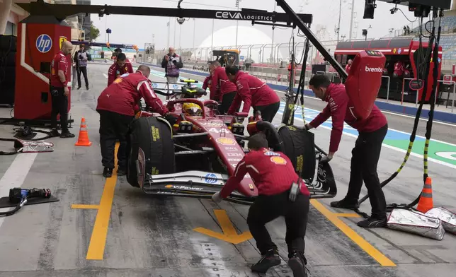 Ferrari driver Lewis Hamilton of Britain makes a pit stop during a Formula One pre-season test at the Bahrain International Circuit in Sakhir, Bahrain, Thursday, Feb. 27, 2025. (AP Photo/Darko Bandic)