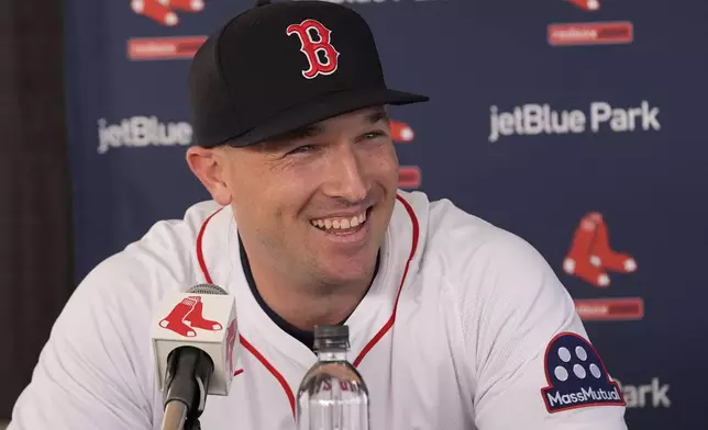 Alex Bregman speaks at a news conference after he signed a three year contract with the Boston Red Sox in Fort Myers, Fla., Sunday, Feb. 16, 2025. (AP Photo/Gerald Herbert)