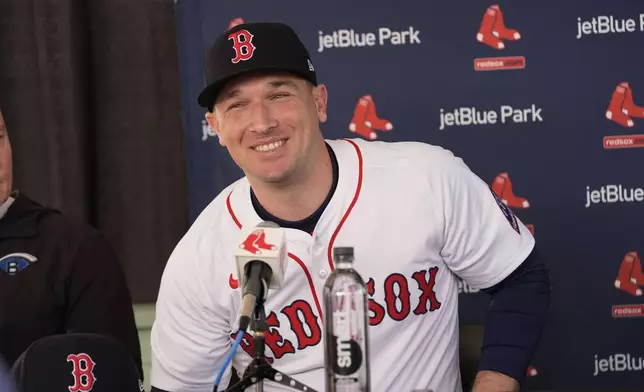 Alex Bregman speaks at a news conference after he signed a three year contract with the Boston Red Sox in Fort Myers, Fla., Sunday, Feb. 16, 2025. (AP Photo/Gerald Herbert)