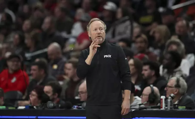 Phoenix Suns head coach Mike Budenholzer talks to players during the second half of an NBA basketball game against the Portland Trail Blazers, Saturday, Feb. 1, 2025, in Portland, Ore. (AP Photo/Amanda Loman)