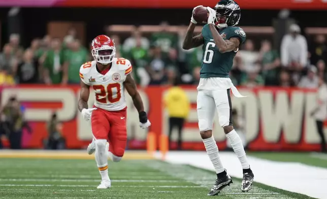 Philadelphia Eagles wide receiver DeVonta Smith (6) makes a catch in front of Kansas City Chiefs safety Justin Reid (20) during the first half of the NFL Super Bowl 59 football game, Sunday, Feb. 9, 2025, in New Orleans. (AP Photo/Abbie Parr)