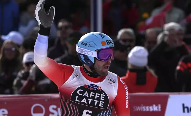 Switzerland's Alexis Monney reacts after completing an alpine ski, men's World Cup downhill, in Crans Montana, Switzerland, Saturday, Feb. 22, 2025. (AP Photo/Giovanni Auletta)