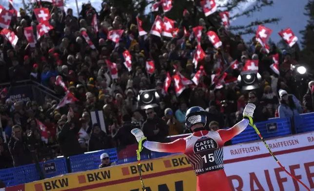 Switzerland's Franjo von Allmen reacts after completing an alpine ski, men's World Cup downhill, in Crans Montana, Switzerland, Saturday, Feb. 22, 2025. (AP Photo/Giovanni Auletta)