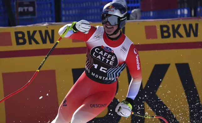Switzerland's Franjo von Allmen reacts after completing an alpine ski, men's World Cup downhill, in Crans Montana, Switzerland, Saturday, Feb. 22, 2025. (AP Photo/Giovanni Auletta)