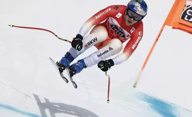Switzerland's Marco Odermatt speeds down the course during an alpine ski, men's World Cup downhill, in Crans Montana, Switzerland, Saturday, Feb. 22, 2025. (AP Photo/Gabriele Facciotti)