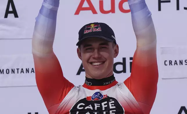 The winner Switzerland's Franjo von Allmen celebrates after an alpine ski, men's World Cup downhill, in Crans Montana, Switzerland, Saturday, Feb. 22, 2025. (AP Photo/Giovanni Auletta)