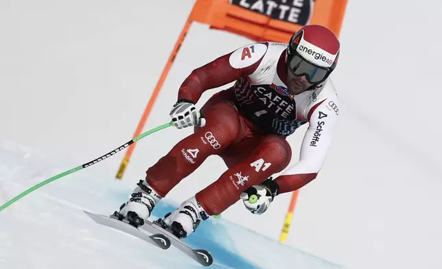 Austria's Vincent Kriechmayr speeds down the course during an alpine ski, men's World Cup downhill, in Crans Montana, Switzerland, Saturday, Feb. 22, 2025. (AP Photo/Gabriele Facciotti)