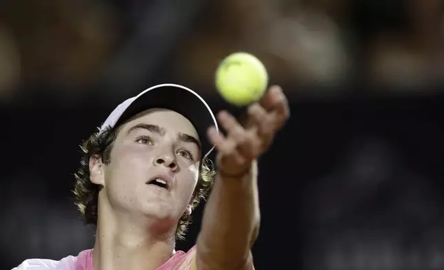Brazil's Joao Fonseca serves to France's Alexandre Muller during a match at the Rio Open tennis tournament in Rio de Janeiro, Tuesday, Feb. 18, 2025. (AP Photo/Bruna Prado)