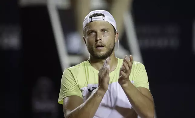 France's Alexandre Muller celebrates after winning a Rio Open tennis match against Brazil's Joao Fonseca in Rio de Janeiro, Tuesday, Feb. 18, 2025. (AP Photo/Bruna Prado)