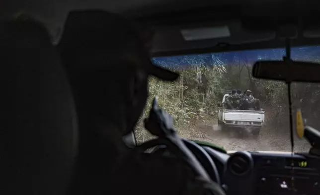 Members of the Lion Intervention Brigade conduct a patrol at Niokolo Koba National Park, Senegal on Tuesday, Jan. 14, 2025. (AP Photo/Annika Hammerschlag)