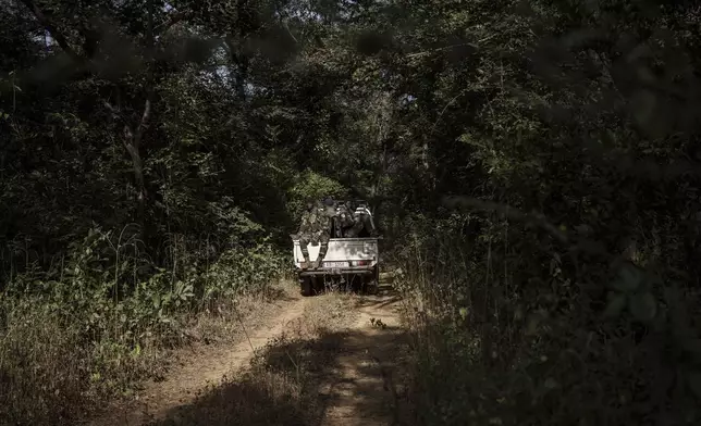 Members of the Lion Intervention Brigade conduct a patrol at Niokolo Koba National Park, Senegal on Tuesday, Jan. 14, 2025. (AP Photo/Annika Hammerschlag)