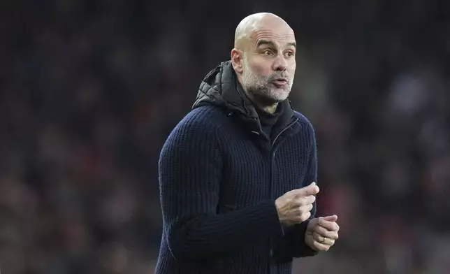 Manchester City's head coach Pep Guardiola gestures during the English Premier League soccer match between Arsenal and Manchester City at the Emirates stadium in London, Sunday, Feb. 2, 2025. (AP Photo/Alastair Grant)