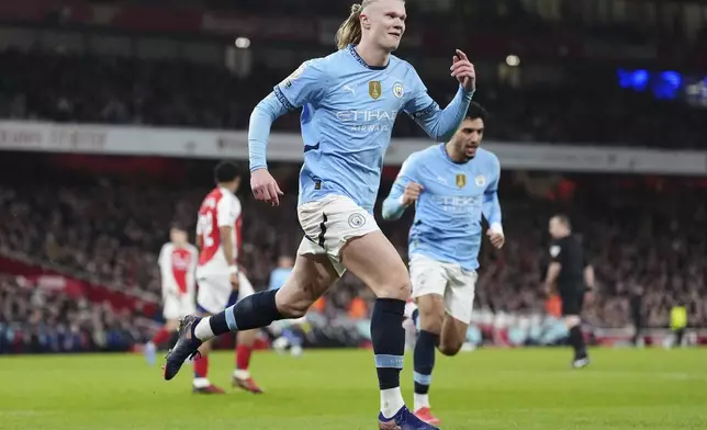 Manchester City's Erling Haaland celebrates scoring his side's first goal during the English Premier League soccer match between Arsenal and Manchester City at the Emirates stadium in London, Sunday, Feb. 2, 2025. (Adam Davy/PA via AP)