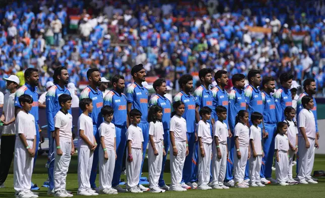 Players of India stands for their national anthem before the start of ICC Champions Trophy cricket match between India and Pakistan at Dubai International Cricket Stadium, United Arab Emirates, Sunday, Feb. 23, 2025. (AP Photo/Altaf Qadri)
