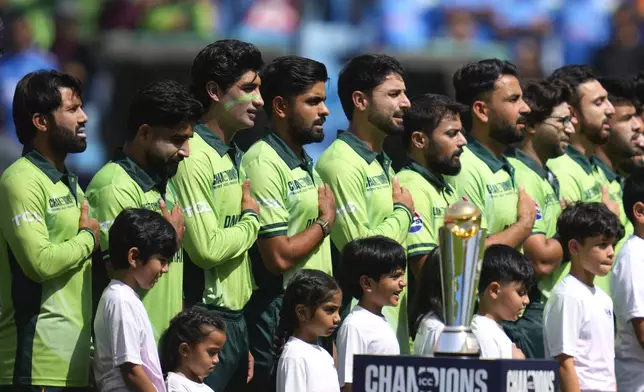 Players of Pakistan stand for their national anthem before the start of ICC Champions Trophy cricket match between India and Pakistan at Dubai International Cricket Stadium, United Arab Emirates, Sunday, Feb. 23, 2025. (AP Photo/Altaf Qadri)
