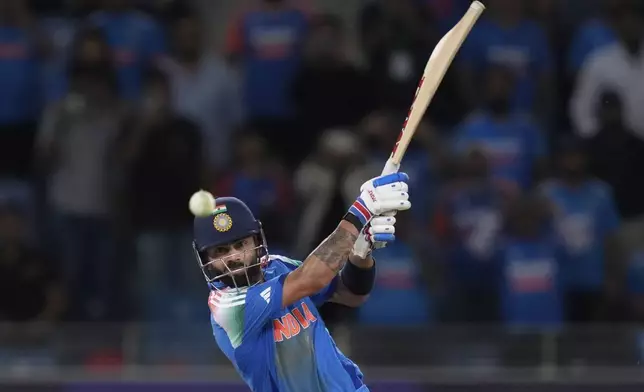 India's Virat Kohli hits winning runs during the ICC Champions Trophy cricket match between India and Pakistan at Dubai International Cricket Stadium, United Arab Emirates, Sunday, Feb. 23, 2025. (AP Photo/Altaf Qadri)