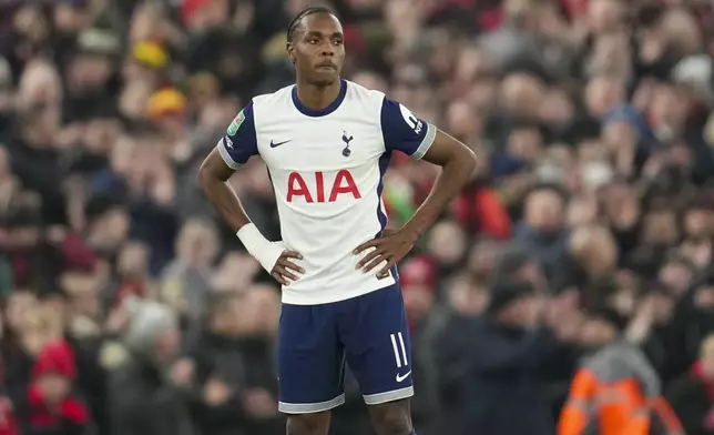 Tottenham's Mathys Tel stands on the pitch during the English League Cup semifinal second leg soccer match between Liverpool and Tottenham Hotspur at Anfield Stadium in Liverpool, England, Thursday, Feb. 6, 2025. (AP Photo/Jon Super)