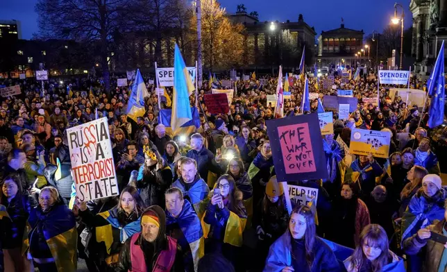 People attend a demonstration against Russia's war on Ukraine as they mark the third anniversary of the full-scale invasion in Berlin, Monday, Feb. 24, 2025. (AP Photo/Ebrahim Noroozi)