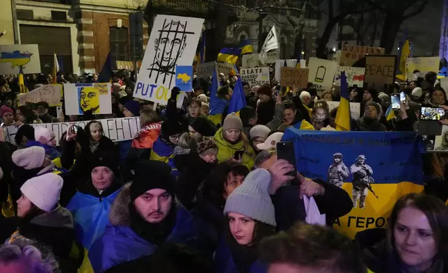 Protesters rallied by Ukrainian and Polish anti-war activists of the Euromaidan-Warsaw group mark the third anniversary of Russia's full-scale war on Ukraine in front of the Ukrainian Embassy in Warsaw, Monday, Feb. 24, 2025. (AP Photo/Czarek Sokolowski)