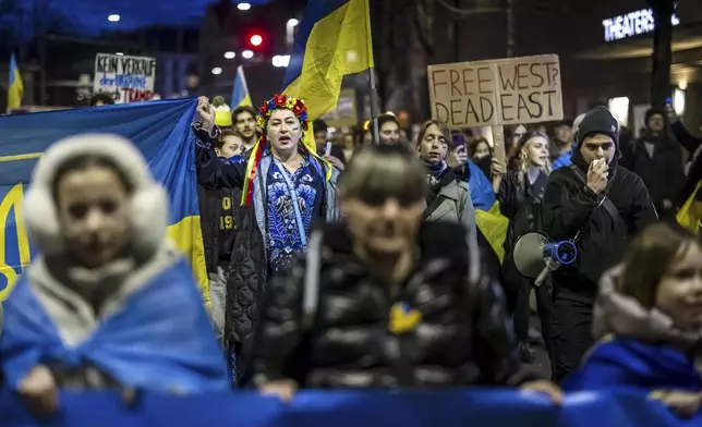 People gather in Zurich, Switzerland., Monday Feb. 24, 2025, marking the three year anniversary of the Russian invasion of Ukraine. (Michael Buholzer/Keystone via AP)