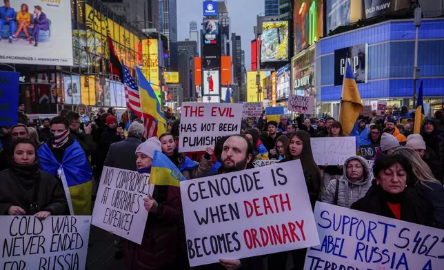 Demonstrators rally in Times Square on the three-year anniversary of Russia's invasion of Ukraine, Monday, Feb. 24, 2025, in New York. (AP Photo/Julia Demaree Nikhinson)