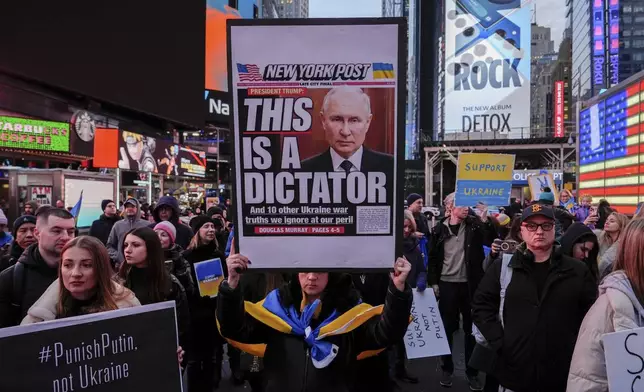 Demonstrators rally in Times Square on the three-year anniversary of Russia's invasion of Ukraine, Monday, Feb. 24, 2025, in New York. (AP Photo/Julia Demaree Nikhinson)