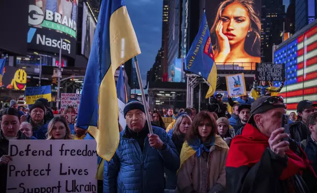 Demonstrators rally in Times Square on the three-year anniversary of Russia's invasion of Ukraine, Monday, Feb. 24, 2025, in New York. (AP Photo/Julia Demaree Nikhinson)