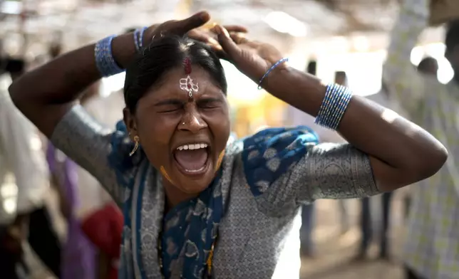 A devotee goes into a trance at the Lingamanthula Swamy temple during a Hindu pilgrimage called the Peddagattu Jatara, in Suryapet, Telangana state, India, Tuesday, Feb. 18, 2025. (AP Photo /Mahesh Kumar A.)