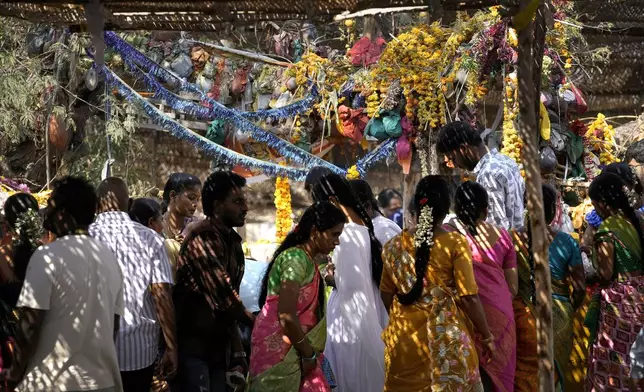 Devotees pray at the Lingamanthula Swamy temple during a Hindu pilgrimage called the Peddagattu Jatara, in Suryapet, Telangana state, India, Sunday, Feb. 16, 2025. (AP Photo /Mahesh Kumar A.)