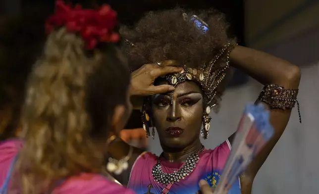 Transgender woman Negriny Venture, of the Paraiso de Tuiuti samba school, prepares to rehearse for the Carnival parade in Rio de Janeiro, Monday, Feb. 17, 2025. (AP Photo/Silvia Izquierdo)