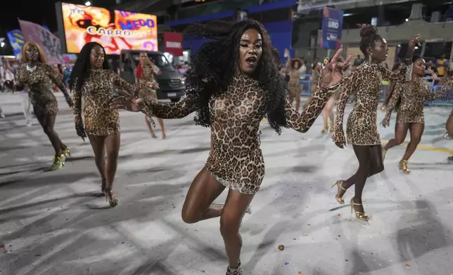 Transgender women with the Paraiso de Tuiuti samba school rehearse for the Carnival parade at the Sambodrome in Rio de Janeiro, Saturday, Feb. 22, 2025. (AP Photo/Silvia Izquierdo)