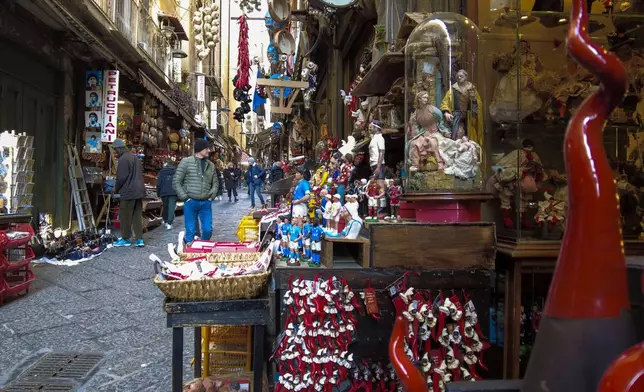 Neapolitan auspicious red horns are on sale in downtown Naples, southern Italy, Wednesday, Feb. 12, 2025. (AP Photo/Trisha Thomas)