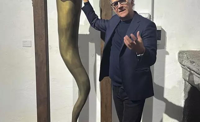 Italian sculptor Lello Esposito is interviewed by The Associated Press in his art gallery in Naples, Wednesday, Feb. 12, 2025. (AP Photo/Giada Zampano)