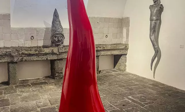 A giant Neapolitan horn, similar to the one he made for the 2024 Bangkok Biennale, is shown inside Italian sculptor Lello Esposito's art gallery in Naples, Wednesday, Feb. 12, 2025. (AP Photo/Giada Zampano)