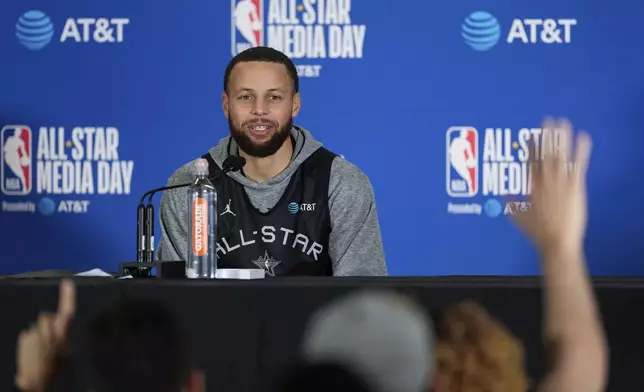 Stephen Curry, of the Golden State Warriors, speaks to media during the NBA All-Star game media day, Saturday, Feb. 15, 2025, in Oakland, Calif. (AP Photo/Godofredo A. Vásquez)